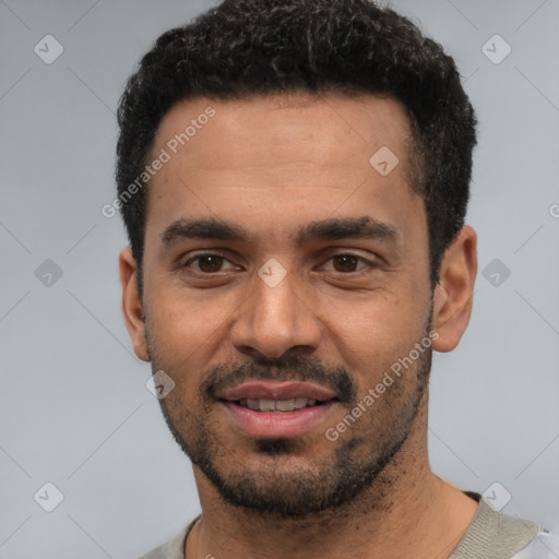 Joyful white young-adult male with short  black hair and brown eyes