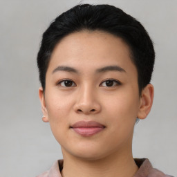 Joyful asian young-adult female with short  black hair and brown eyes