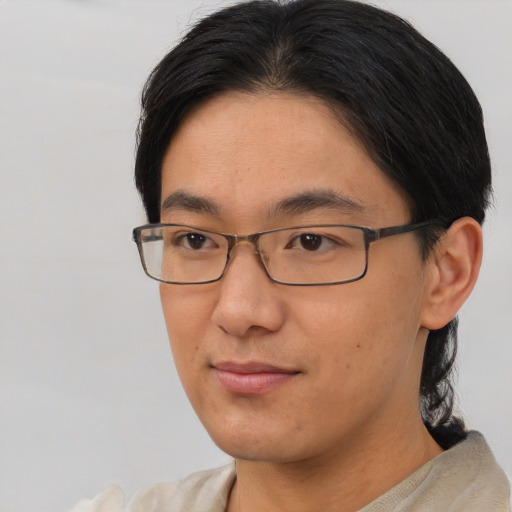 Neutral asian young-adult male with short  brown hair and brown eyes