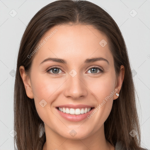 Joyful white young-adult female with long  brown hair and grey eyes