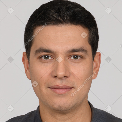 Joyful white young-adult male with short  black hair and brown eyes