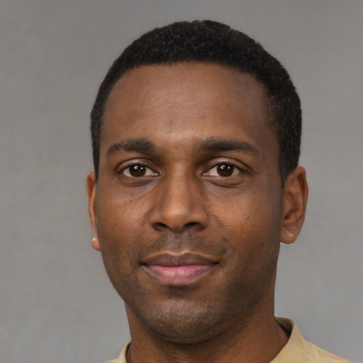 Neutral black young-adult male with short  black hair and brown eyes
