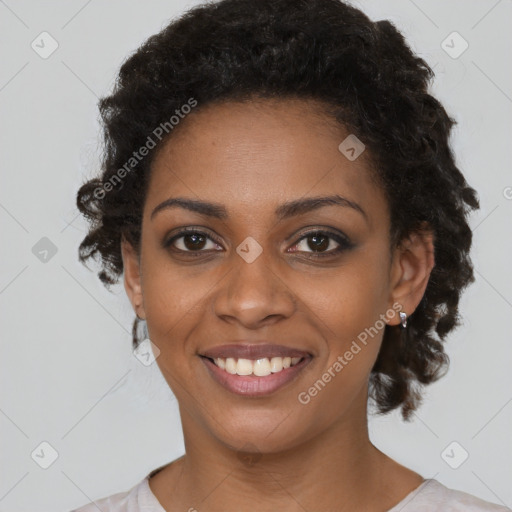 Joyful black young-adult female with medium  brown hair and brown eyes