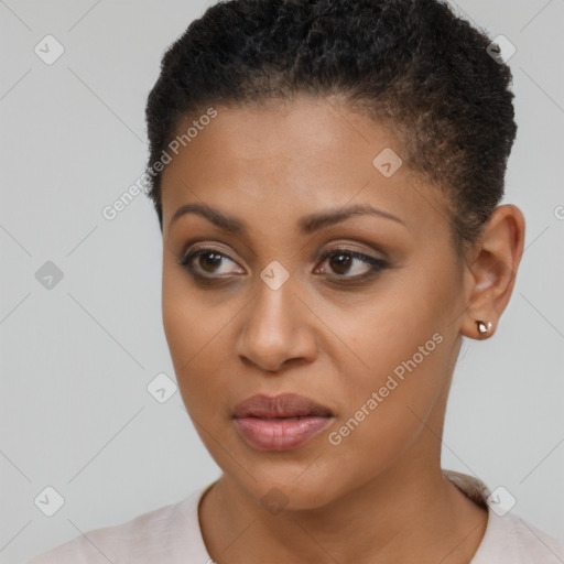 Joyful black young-adult female with short  brown hair and brown eyes