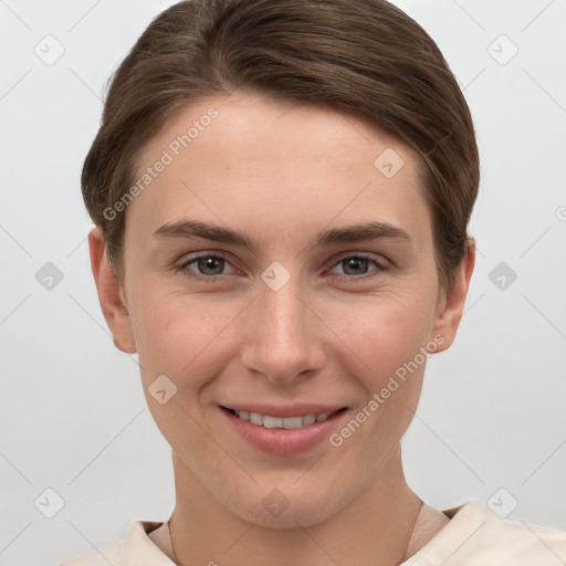 Joyful white young-adult female with short  brown hair and grey eyes