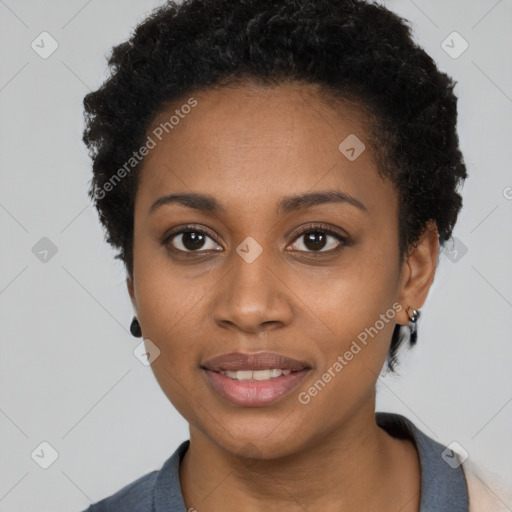 Joyful black young-adult female with short  black hair and brown eyes