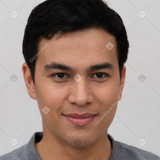 Joyful asian young-adult male with short  brown hair and brown eyes