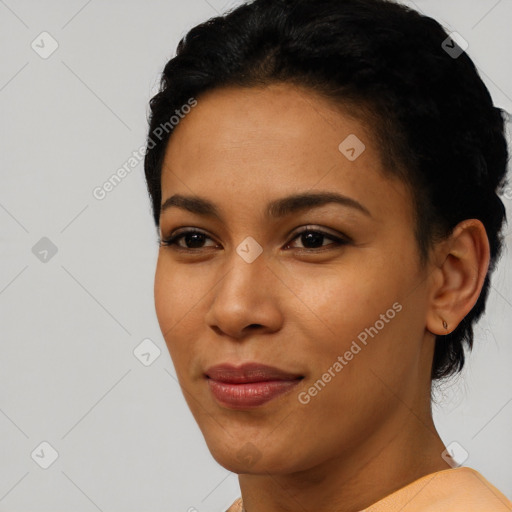 Joyful latino young-adult female with short  black hair and brown eyes