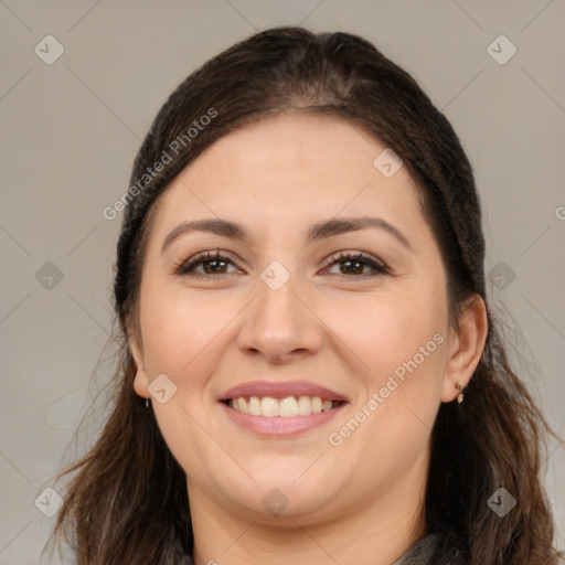 Joyful white young-adult female with long  brown hair and brown eyes