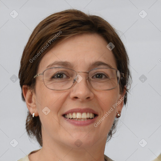 Joyful white adult female with medium  brown hair and green eyes