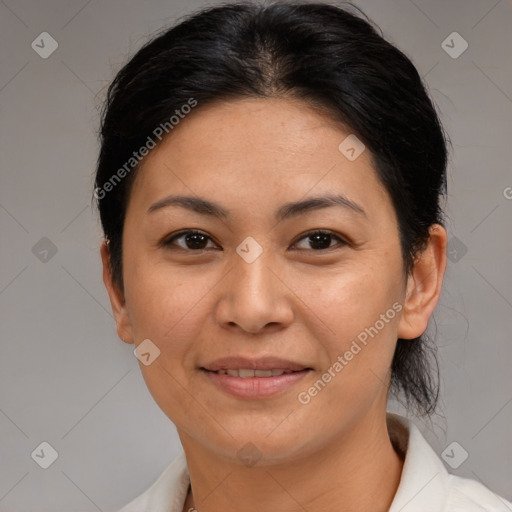 Joyful asian adult female with medium  brown hair and brown eyes