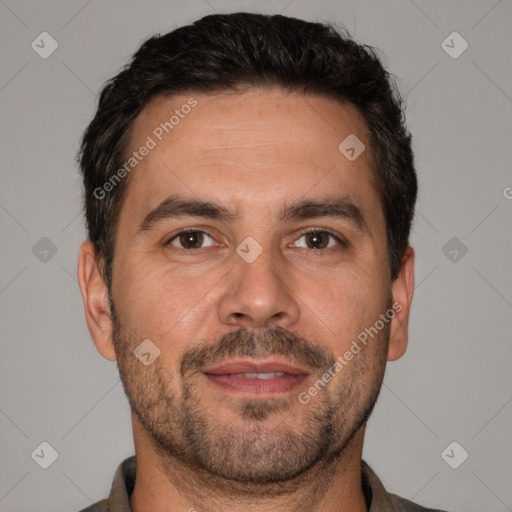 Joyful white adult male with short  brown hair and brown eyes