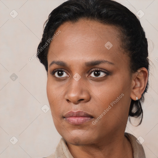 Joyful black young-adult female with short  brown hair and brown eyes