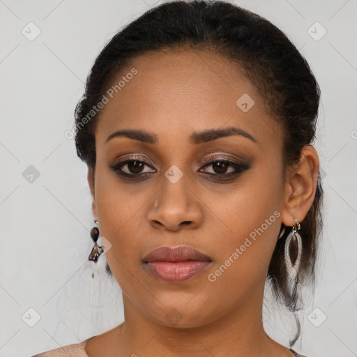 Joyful black young-adult female with medium  black hair and brown eyes