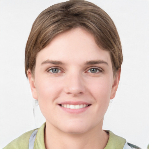 Joyful white young-adult female with short  brown hair and grey eyes