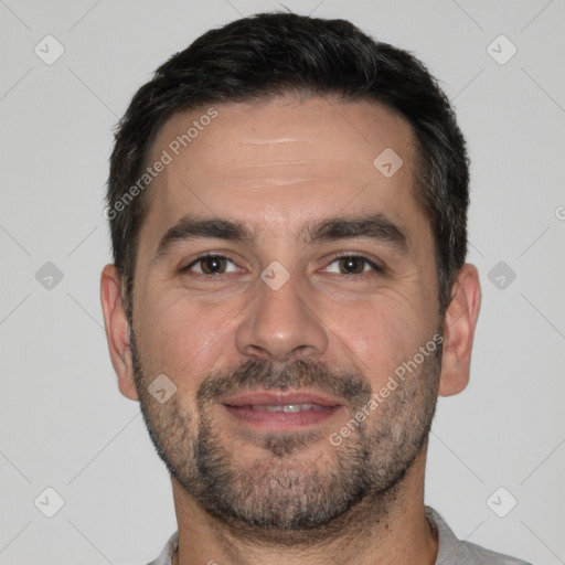 Joyful white adult male with short  brown hair and brown eyes