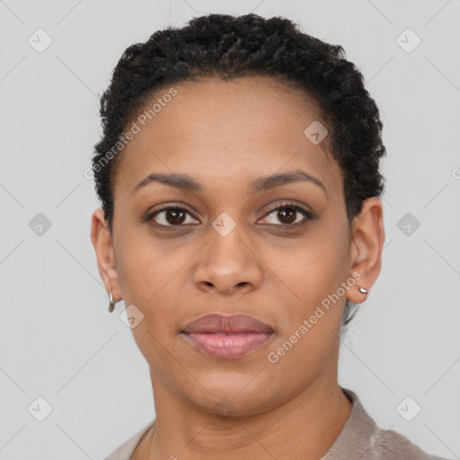 Joyful black young-adult female with short  black hair and brown eyes