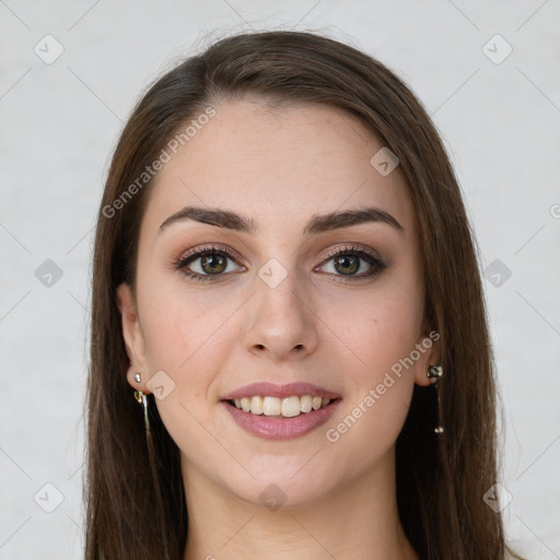 Joyful white young-adult female with long  brown hair and green eyes