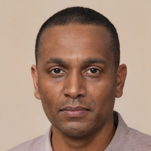 Neutral black young-adult male with short  black hair and brown eyes