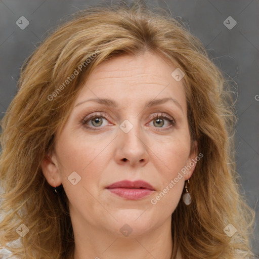 Joyful white adult female with medium  brown hair and blue eyes