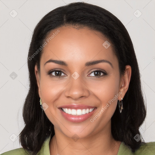 Joyful latino young-adult female with long  black hair and brown eyes