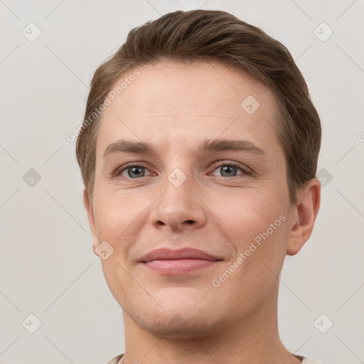 Joyful white young-adult female with short  brown hair and grey eyes