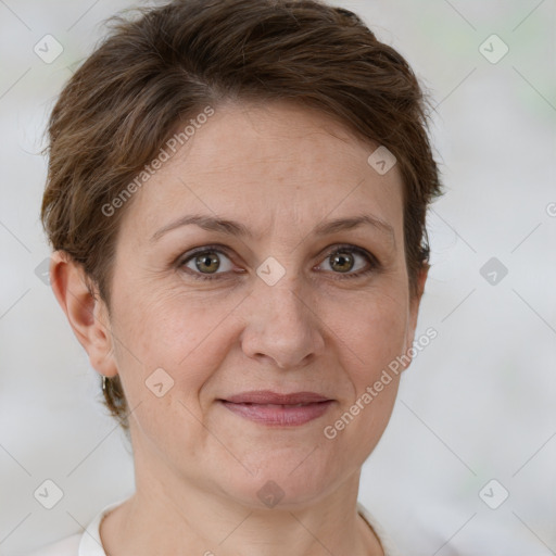 Joyful white adult female with short  brown hair and grey eyes