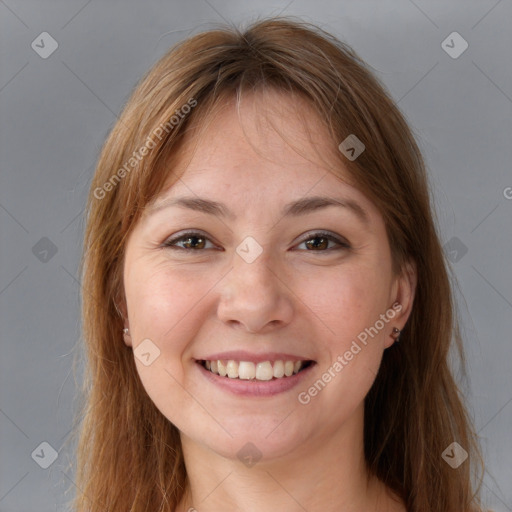 Joyful white young-adult female with long  brown hair and brown eyes