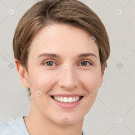 Joyful white young-adult female with short  brown hair and grey eyes