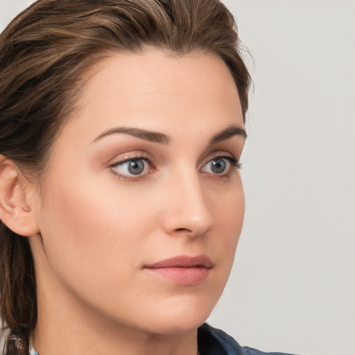 Neutral white young-adult female with long  brown hair and grey eyes