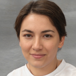 Joyful white young-adult female with medium  brown hair and brown eyes