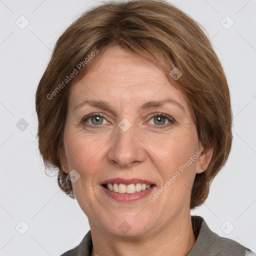 Joyful white adult female with medium  brown hair and grey eyes