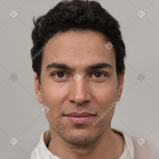 Joyful white young-adult male with short  black hair and brown eyes