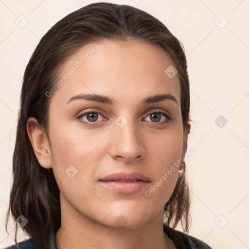 Neutral white young-adult female with long  brown hair and brown eyes