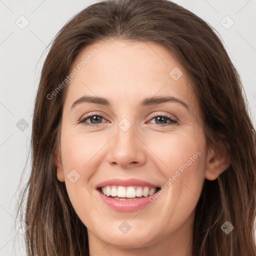 Joyful white young-adult female with long  brown hair and grey eyes