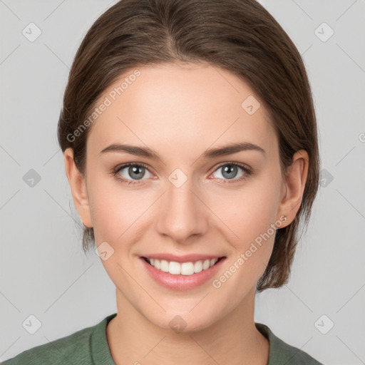 Joyful white young-adult female with medium  brown hair and green eyes