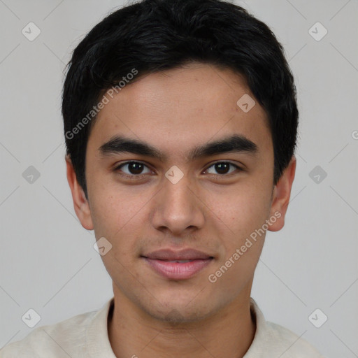 Joyful white young-adult male with short  black hair and brown eyes