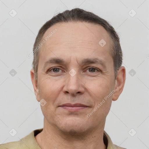 Joyful white adult male with short  brown hair and brown eyes