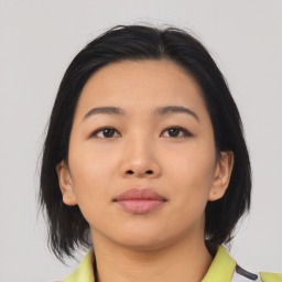 Neutral asian young-adult female with medium  brown hair and brown eyes