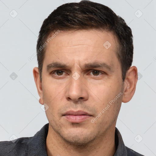 Neutral white adult male with short  brown hair and brown eyes