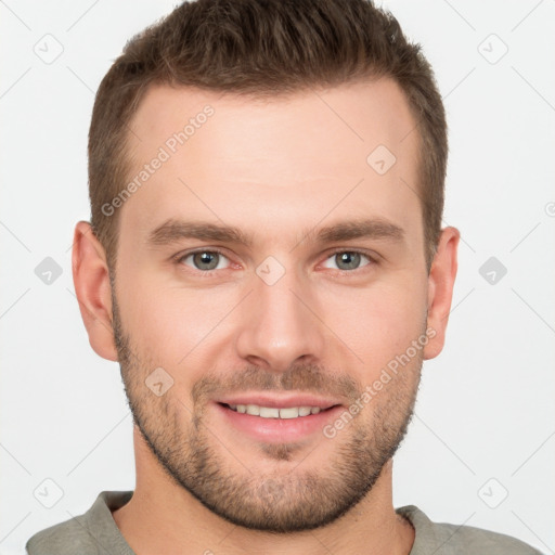 Joyful white young-adult male with short  brown hair and grey eyes