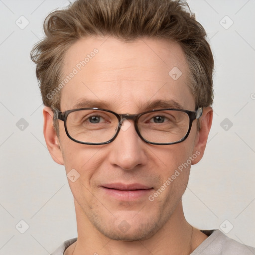 Joyful white adult male with short  brown hair and grey eyes