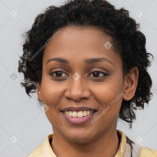 Joyful black young-adult female with long  brown hair and brown eyes