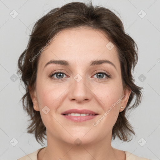 Joyful white young-adult female with medium  brown hair and green eyes