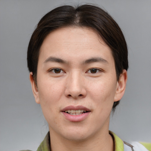 Joyful asian young-adult female with medium  brown hair and brown eyes