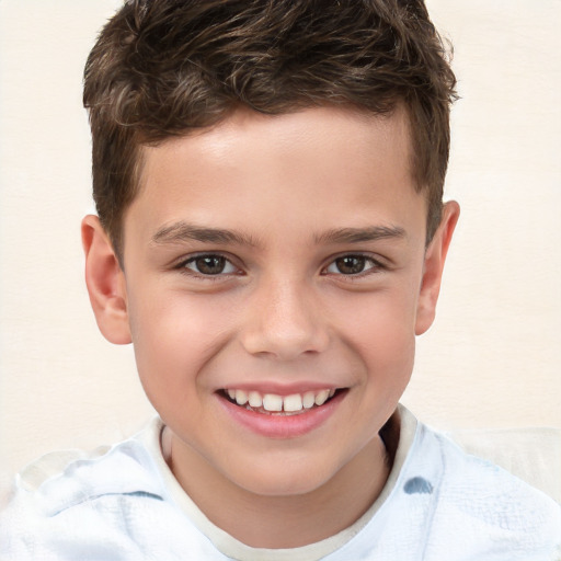 Joyful white child male with short  brown hair and brown eyes