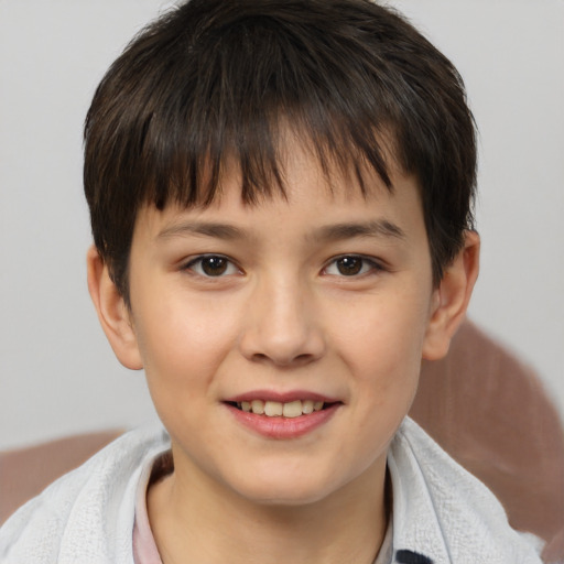 Joyful white child female with short  brown hair and brown eyes