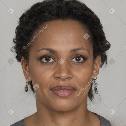 Joyful black adult female with short  brown hair and brown eyes