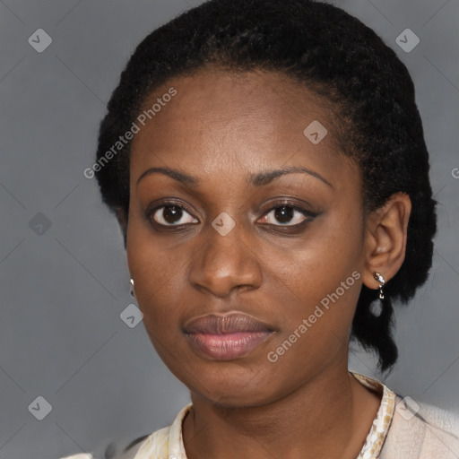 Joyful black adult female with short  brown hair and brown eyes