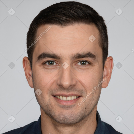 Joyful white young-adult male with short  brown hair and brown eyes